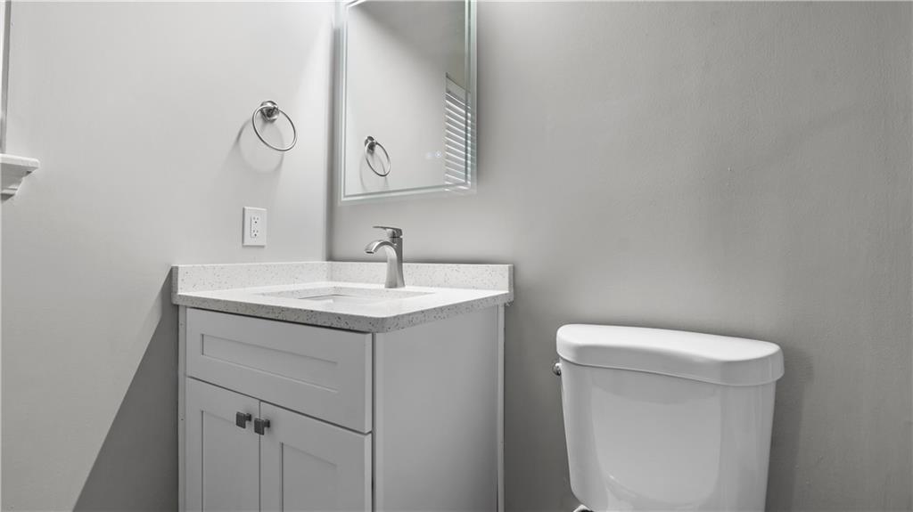 2793 Keystone Avenue Lithonia, GA 30058 - Photo 12 of 33 a bathroom with a sink vanity and a toilet