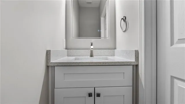 a balcony with wooden floor and fence