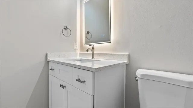 an empty room with wooden floor and a window