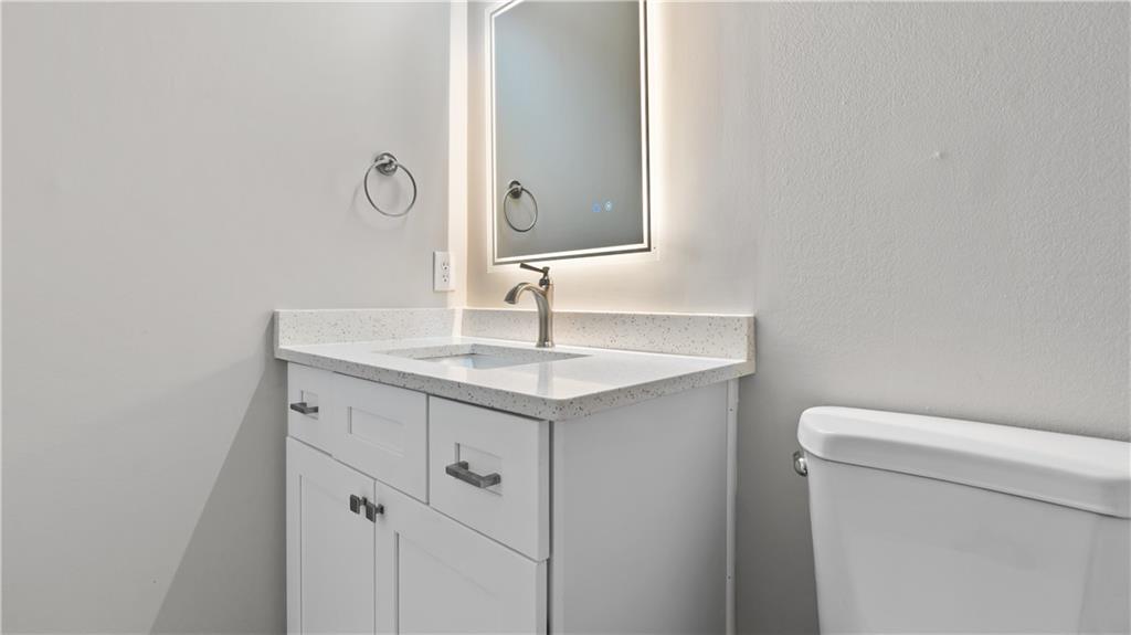 2793 Keystone Avenue Lithonia, GA 30058 - Photo 30 of 33 a bathroom with a sink and a toilet