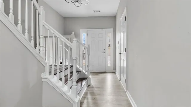 a view of entryway with wooden floor