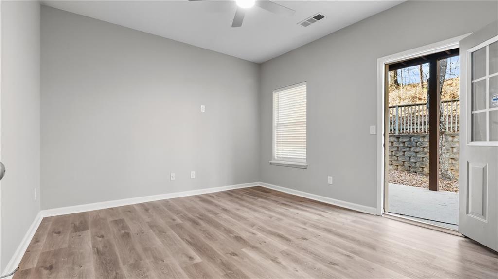 2793 Keystone Avenue Lithonia, GA 30058 - Photo 9 of 33 wooden floor in an empty room with a window