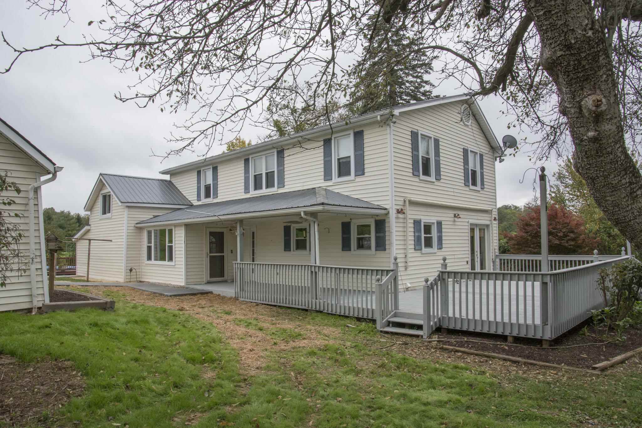 1377 Mt Solon Road Mount Solon, VA 22843 - Photo 1 of 52 a view of a house with a yard and deck