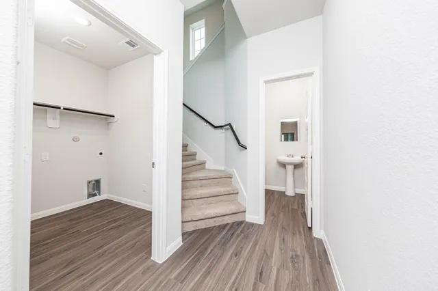 a view of entryway with wooden floor