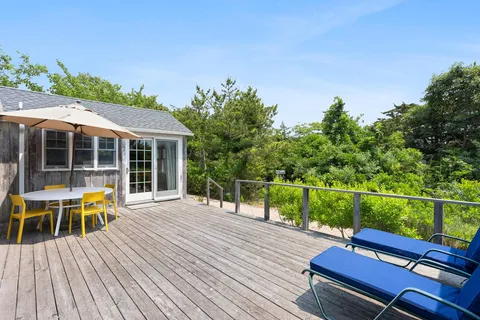 swimming pool view with a seating space