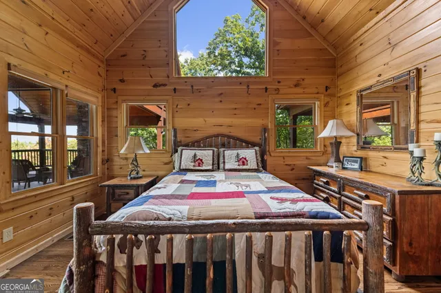 a view of a living room with furniture and wooden floor
