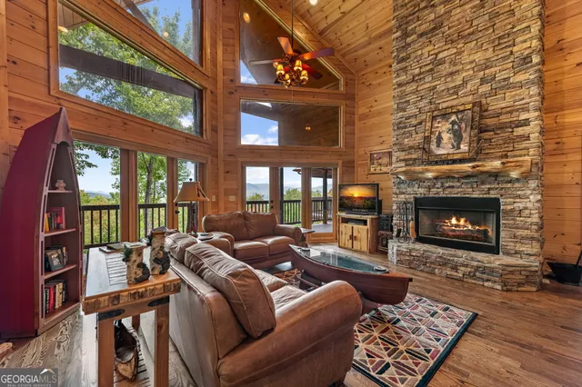 a front view of a house with a garden and balcony
