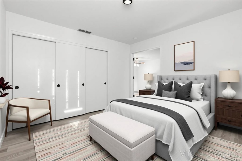 1420 Sherman Avenue, Unit 27 Chico, CA 95926 - Photo 18 of 29 a spacious bedroom with a bed and wooden floor