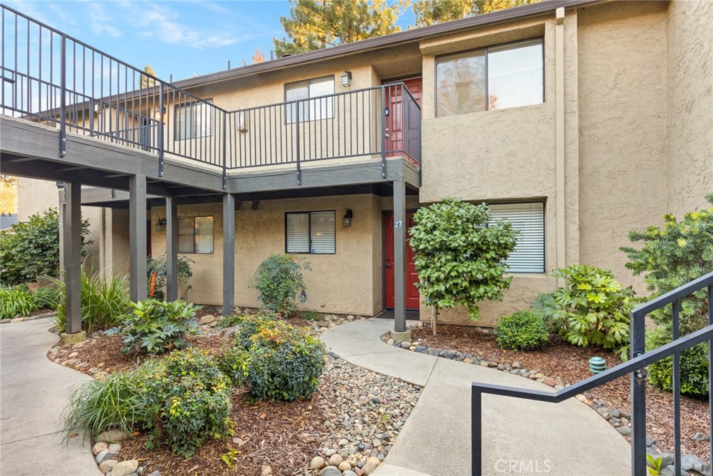 1420 Sherman Avenue, Unit 27 Chico, CA 95926 - Photo 2 of 29 a view of a house with potted plants and a table and chairs