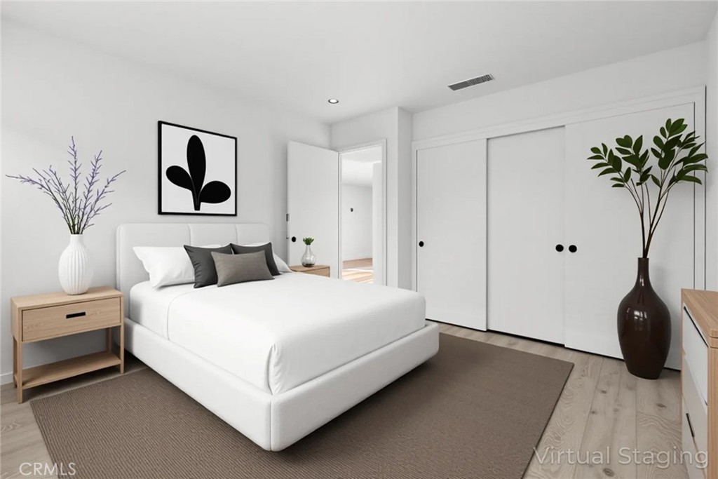 1420 Sherman Avenue, Unit 27 Chico, CA 95926 - Photo 21 of 29 a bedroom with a bed and a potted plant