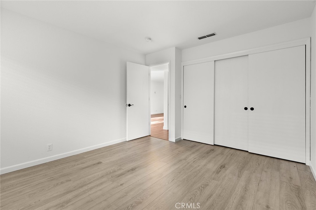 1420 Sherman Avenue, Unit 27 Chico, CA 95926 - Photo 22 of 29 a view of an empty room with wooden floor