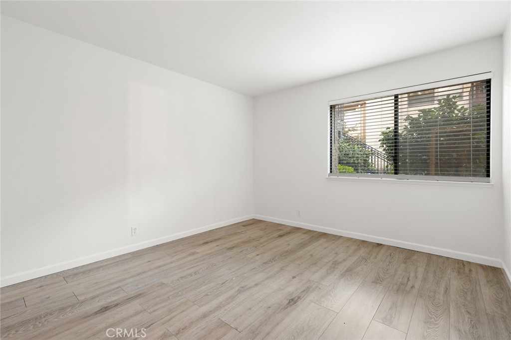 1420 Sherman Avenue, Unit 27 Chico, CA 95926 - Photo 24 of 29 wooden floor in an empty room with a window