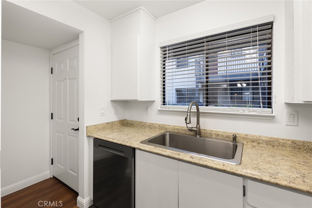 1420 Sherman Avenue, Unit 27 Chico, CA 95926 - Photo 6 of 29 a kitchen with stainless steel appliances granite countertop a sink and a window