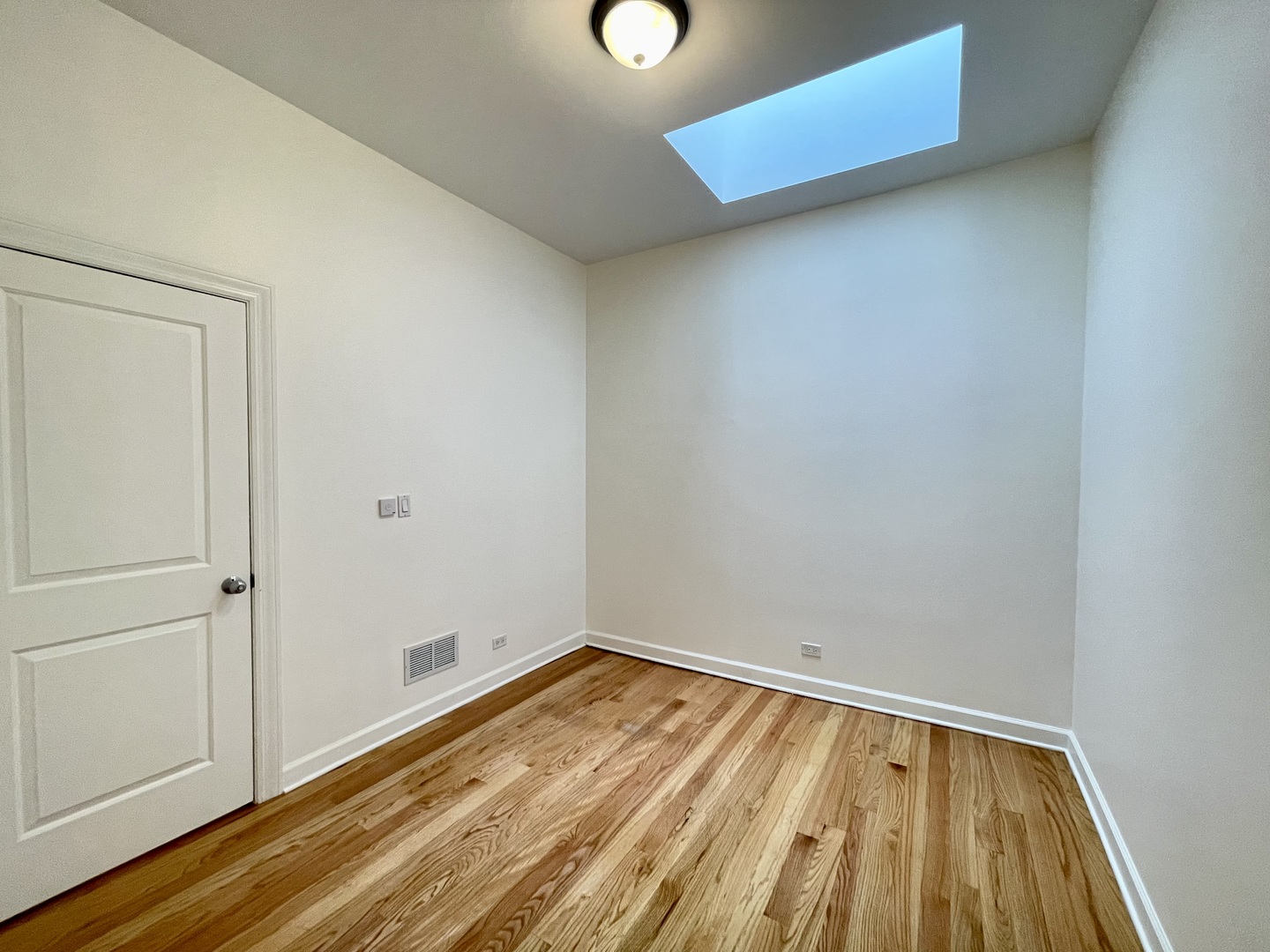 1746 West Division Street, Unit 3 Chicago, IL 60622 - Photo 14 of 20 a view of a room with wooden floor and white walls