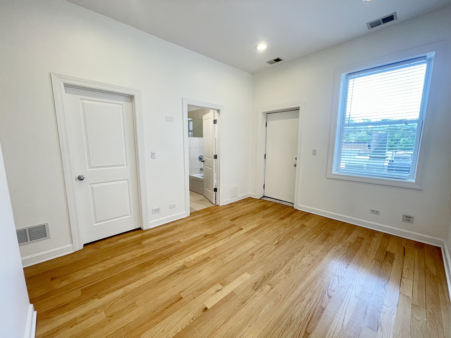 1746 West Division Street, Unit 3 Chicago, IL 60622 - Photo 17 of 20 a view of empty room with wooden floor and fan
