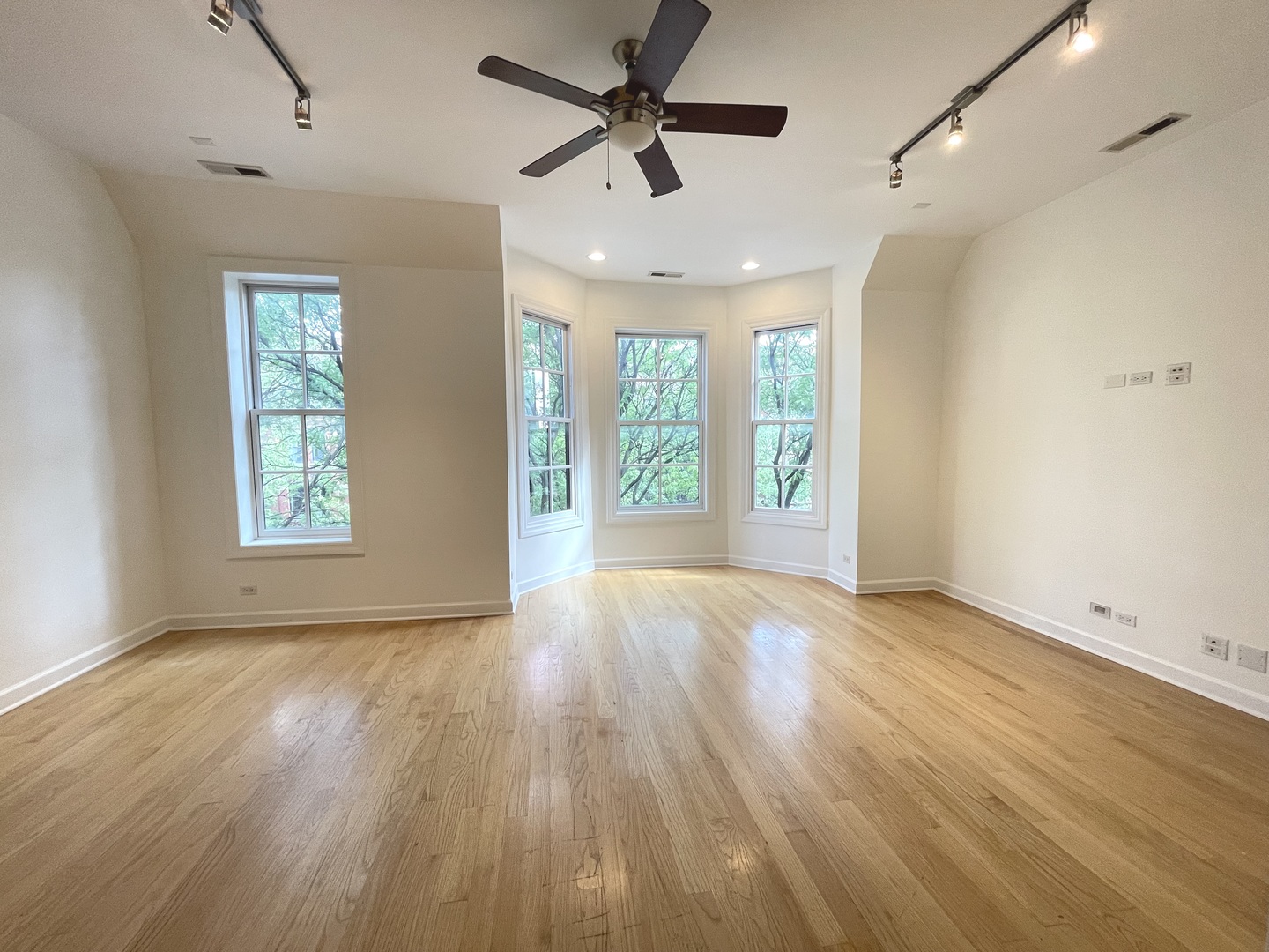 1746 West Division Street, Unit 3 Chicago, IL 60622 - Photo 10 of 20 a view of an empty room with a window and wooden floor