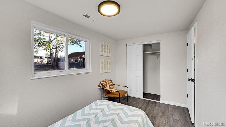 3984 Cook Street Denver, CO 80205 - Photo 14 of 34 a bedroom with bed and a window