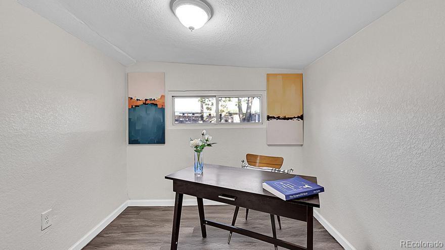 3984 Cook Street Denver, CO 80205 - Photo 17 of 34 a view of a workspace with furniture and window