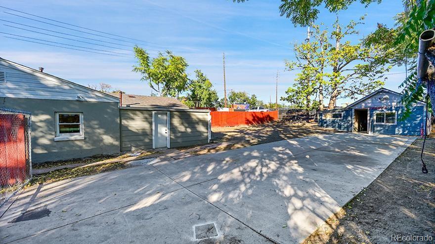 3984 Cook Street Denver, CO 80205 - Photo 18 of 34 a view of a house with a yard