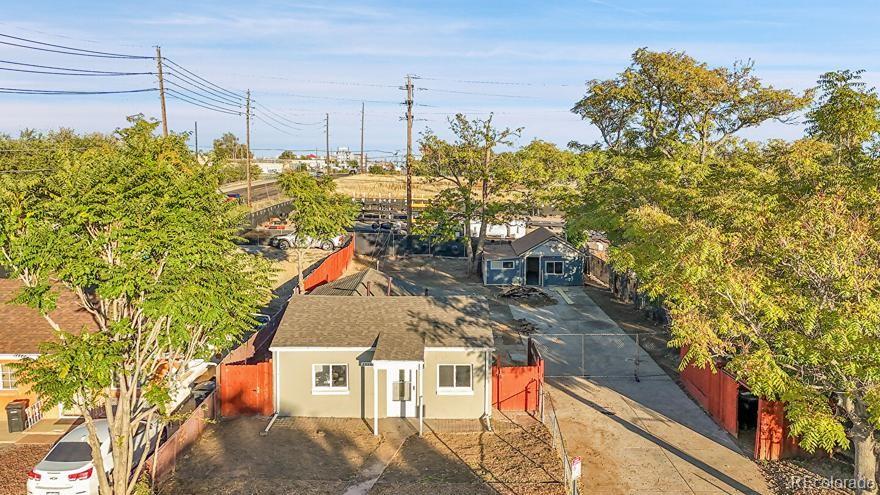 3984 Cook Street Denver, CO 80205 - Photo 21 of 34 a aerial view of a house with a yard and sitting area