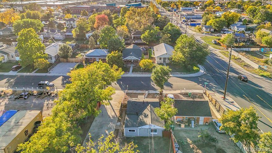 3984 Cook Street Denver, CO 80205 - Photo 22 of 34 an aerial view of residential houses with outdoor space