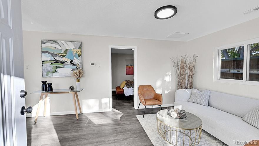 3984 Cook Street Denver, CO 80205 - Photo 3 of 34 a living room with furniture