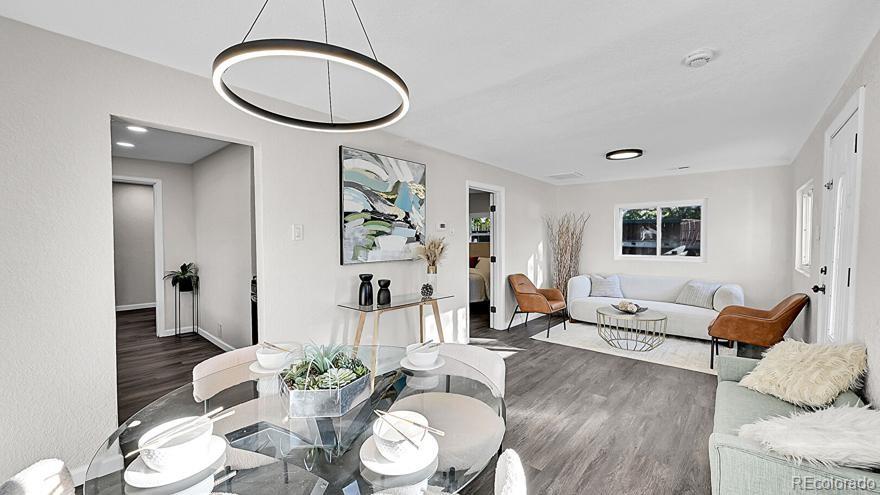 3984 Cook Street Denver, CO 80205 - Photo 6 of 34 a living room with furniture potted plant and a mirror