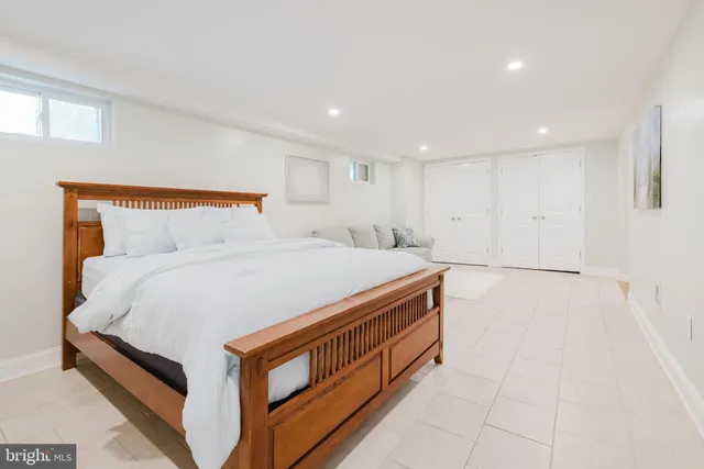 a large white bed in a white room