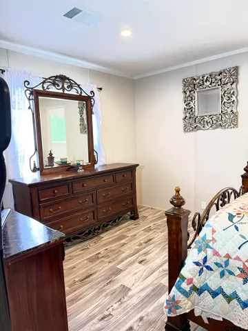 a bed room with a bed and a mirror