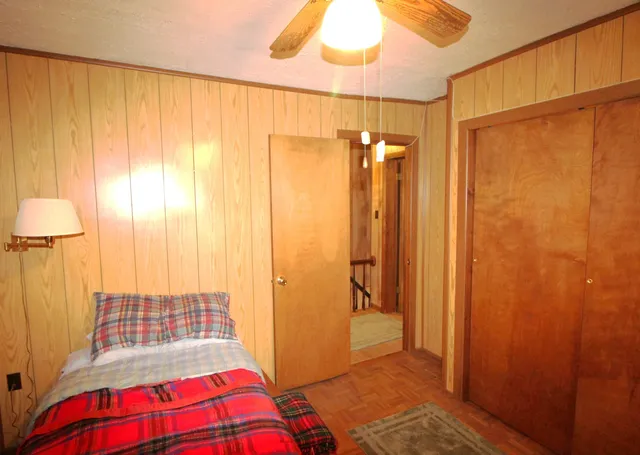 a bedroom with a bed and a shower