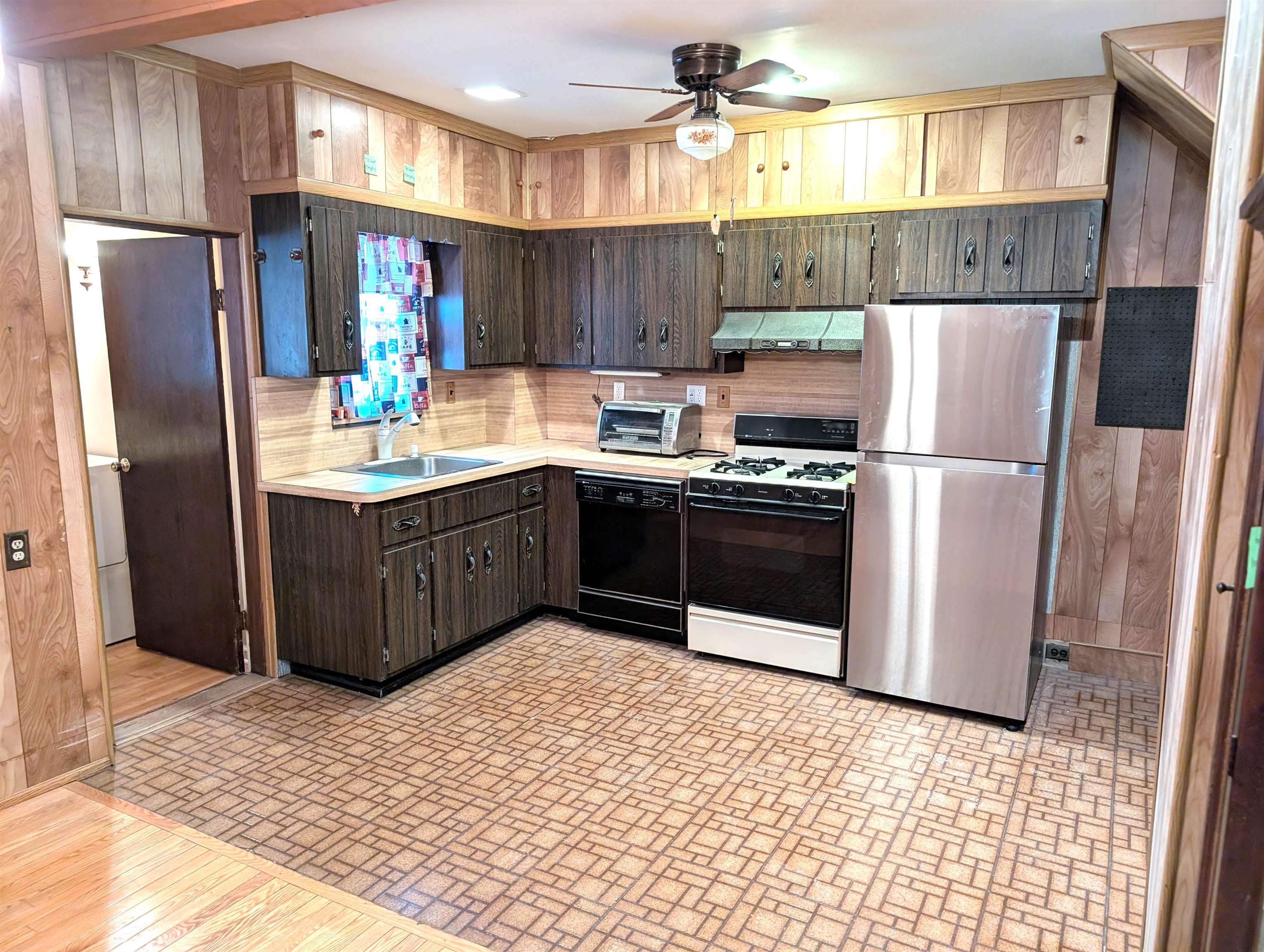 425 Davis Avenue Kearny, NJ 07032 - Photo 4 of 26 a kitchen with stainless steel appliances a refrigerator and a stove