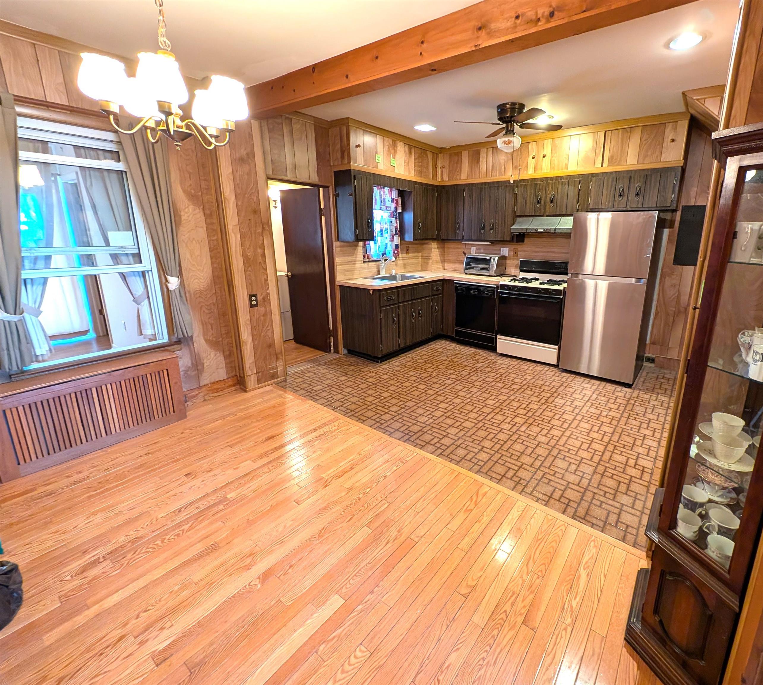 425 Davis Avenue Kearny, NJ 07032 - Photo 6 of 26 a kitchen with stainless steel appliances kitchen island granite countertop a refrigerator and a stove