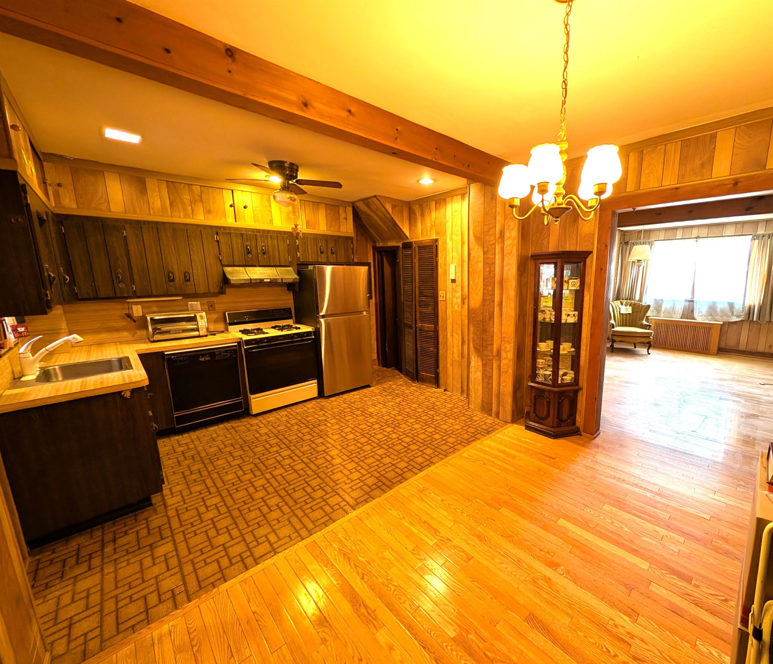 425 Davis Avenue Kearny, NJ 07032 - Photo 7 of 26 a kitchen with stainless steel appliances granite countertop a stove a sink and a refrigerator