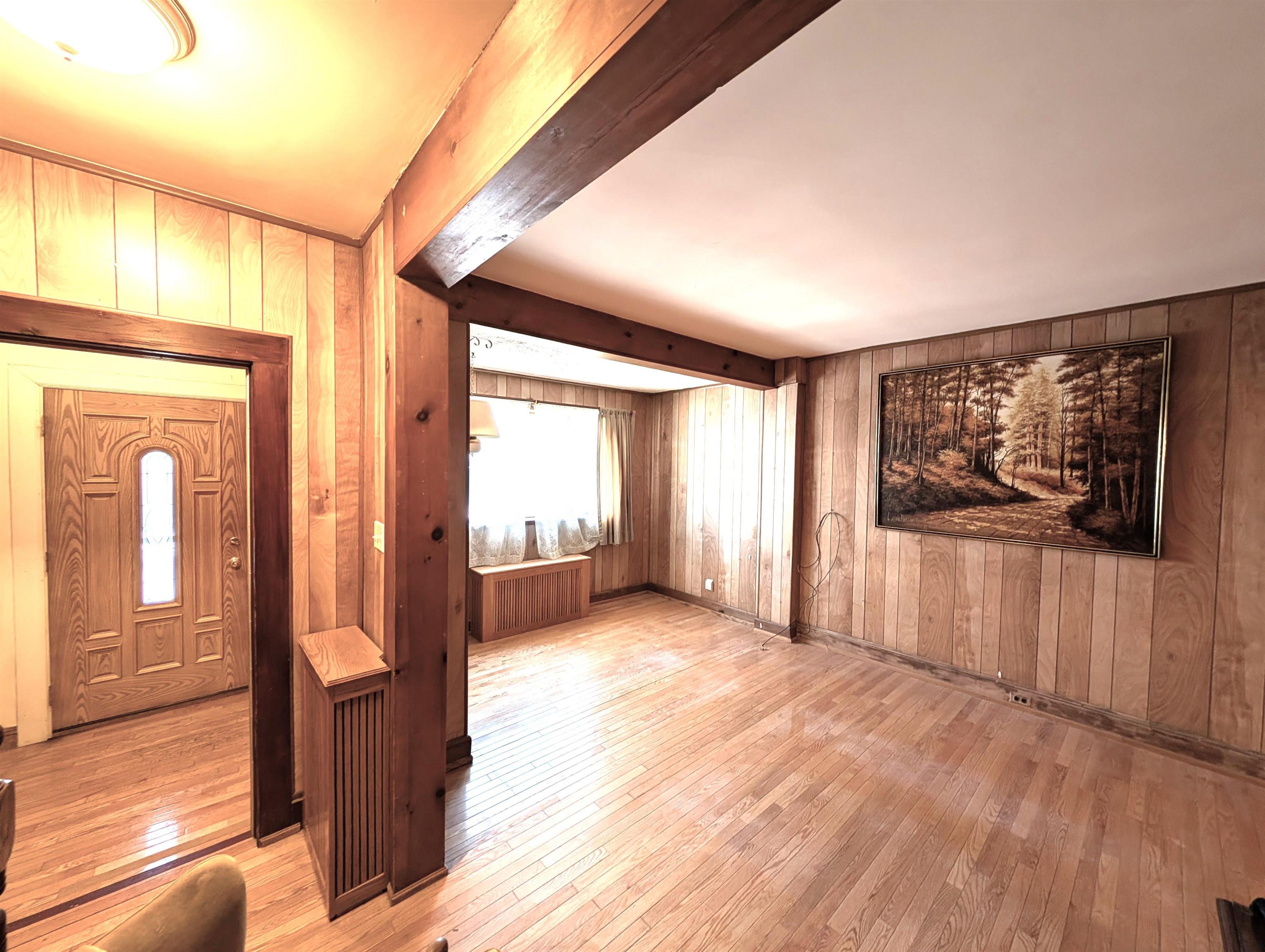 425 Davis Avenue Kearny, NJ 07032 - Photo 9 of 26 a view of a room with wooden floor and windows