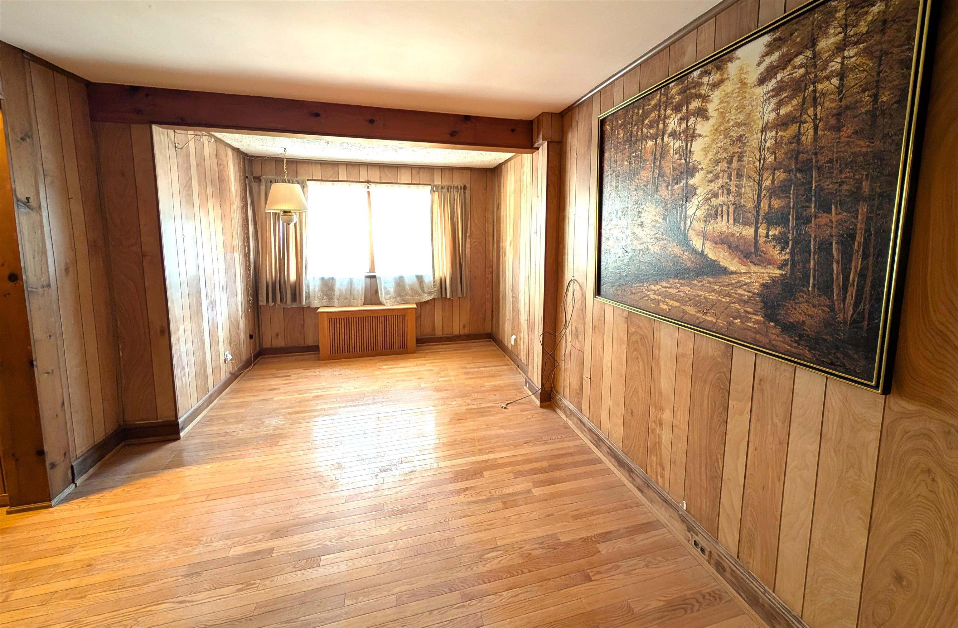 425 Davis Avenue Kearny, NJ 07032 - Photo 10 of 26 a view of a room with wooden floor and furniture