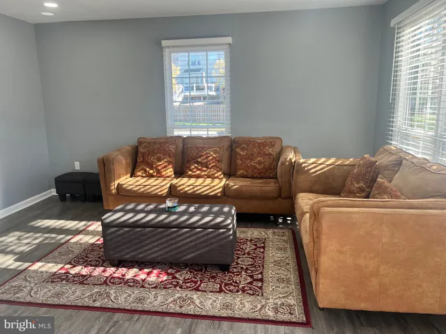 a living room with furniture and a rug