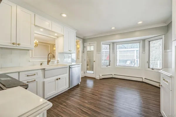 a kitchen with sink and cabinets