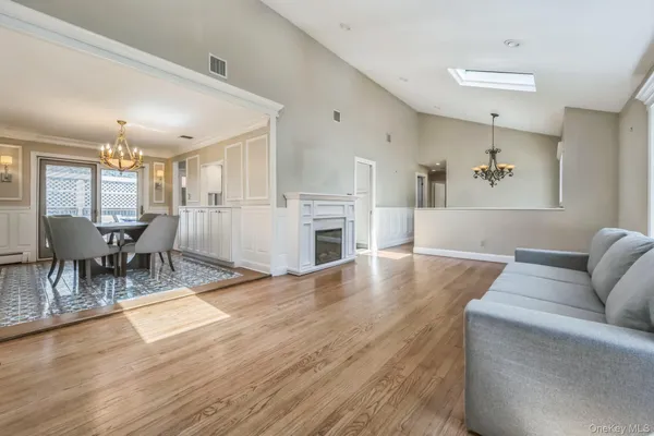 a bathroom with a toilet sink a mirror and vanity
