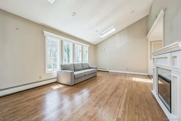 a living room with a couch and a fireplace