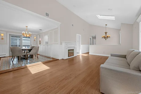 a view of empty room with a fireplace