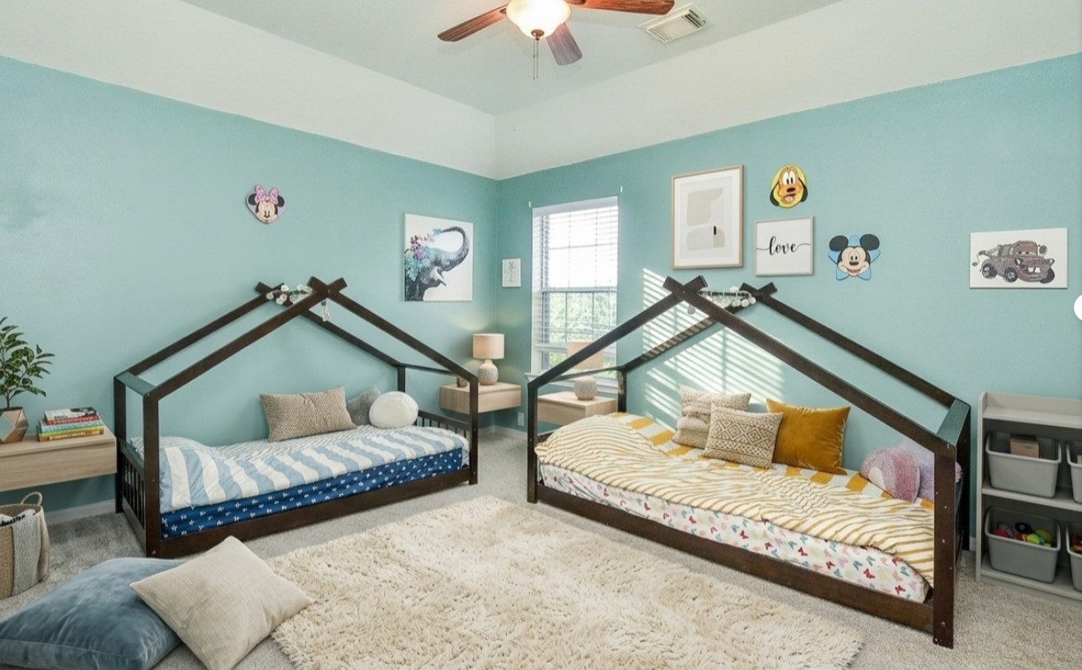 19802 Shavon Springs Drive Spring, TX 77388 - Photo 23 of 30 Cozy room with house-shaped beds, playful decor, and abundant natural light—perfect for creativity and comfort. Virtually staged.