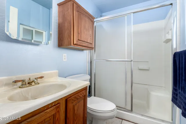 a bathroom with a sink toilet and vanity