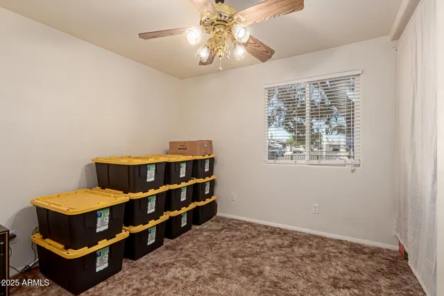 a bedroom with furniture and window