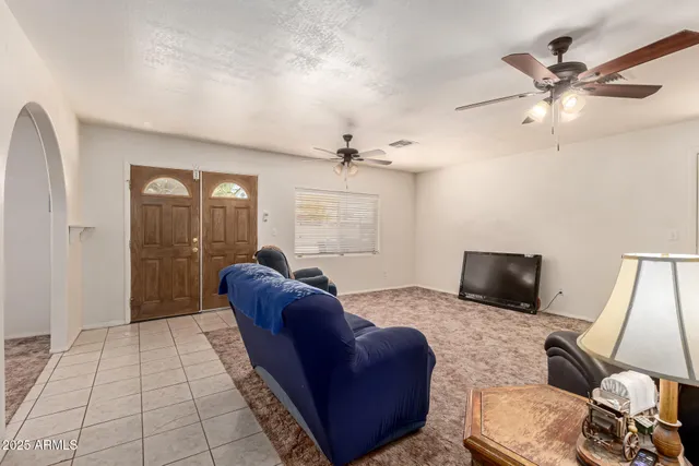 a living room with furniture and a window