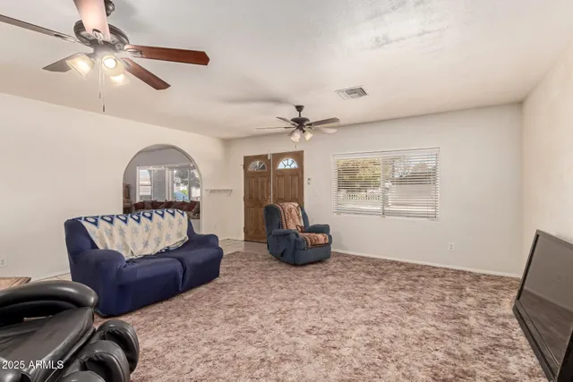 a living room with furniture and a window
