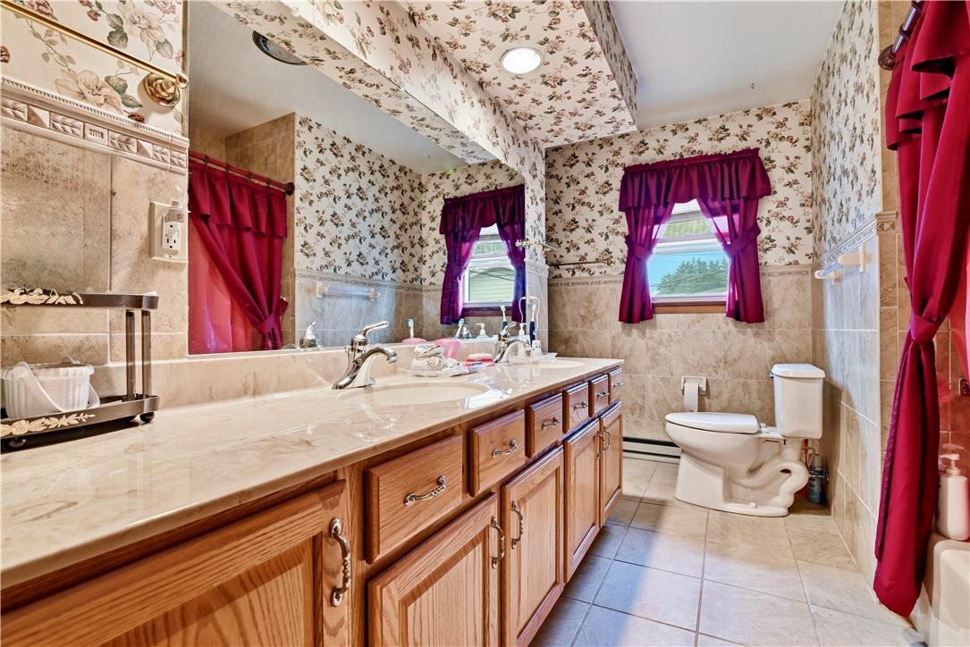 3303 Barklay Road Whitehall, PA 18052 - Photo 22 of 31 Dual vanities with gleaming faucets highlight this well-appointed bathroom.