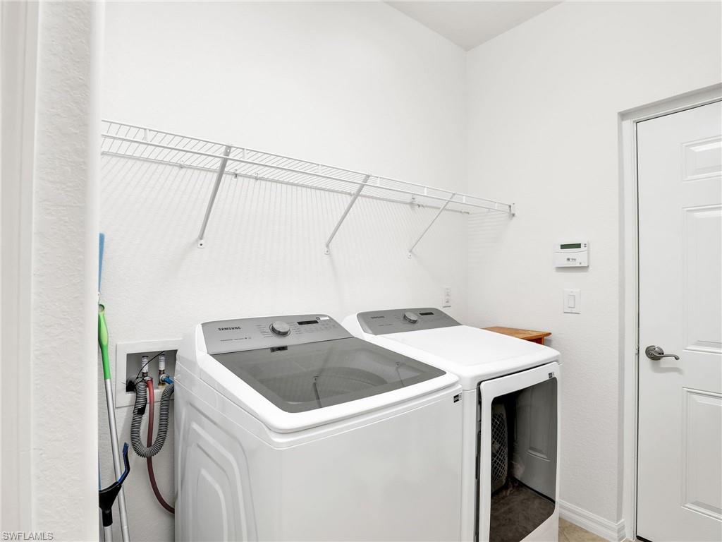 9066 Albion Lane North, Unit 5103 Naples, FL 34113 - Photo 26 of 40 a utility room with dryer and washer
