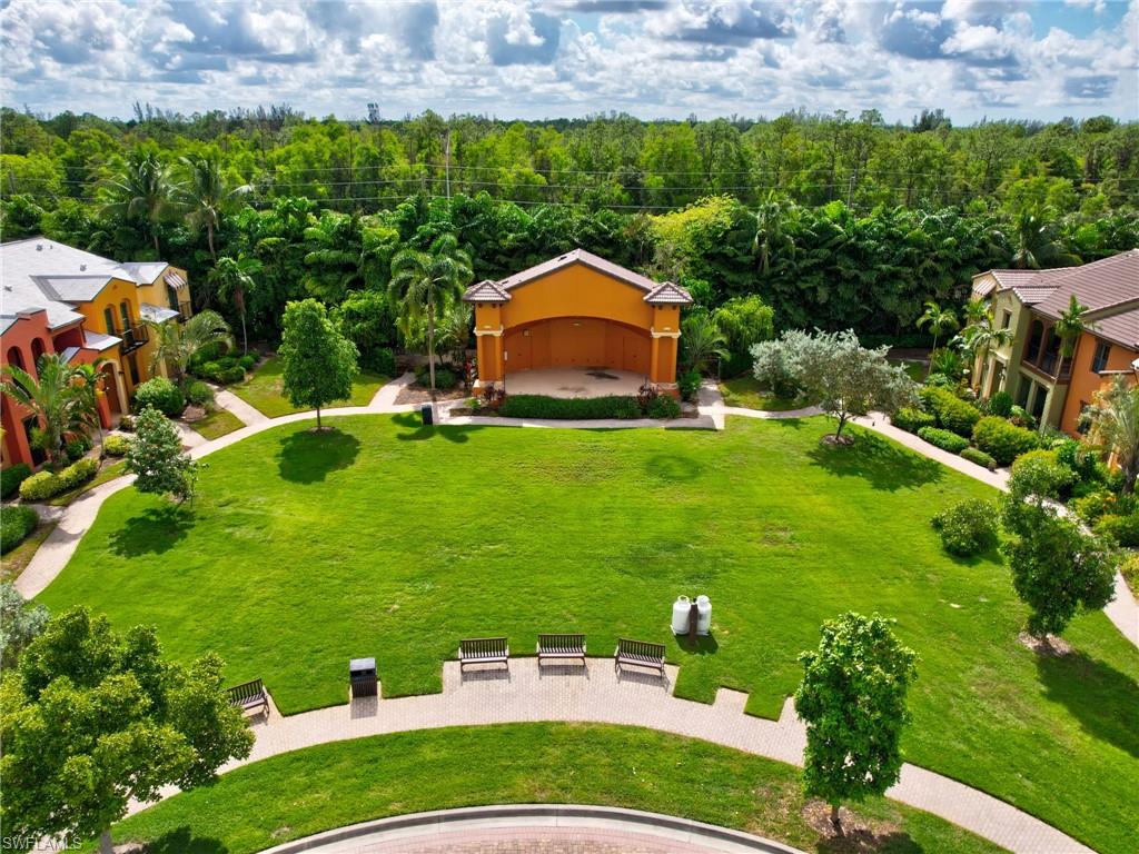 9066 Albion Lane North, Unit 5103 Naples, FL 34113 - Photo 33 of 40 a backyard of a house with lots of green space