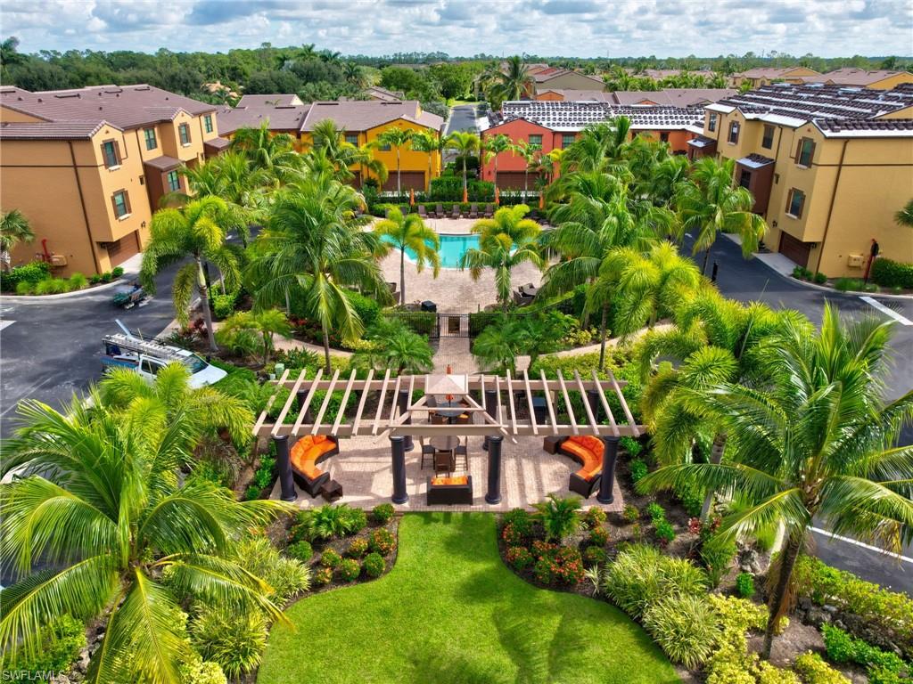 9066 Albion Lane North, Unit 5103 Naples, FL 34113 - Photo 35 of 40 an aerial view of residential houses with outdoor space and swimming pool