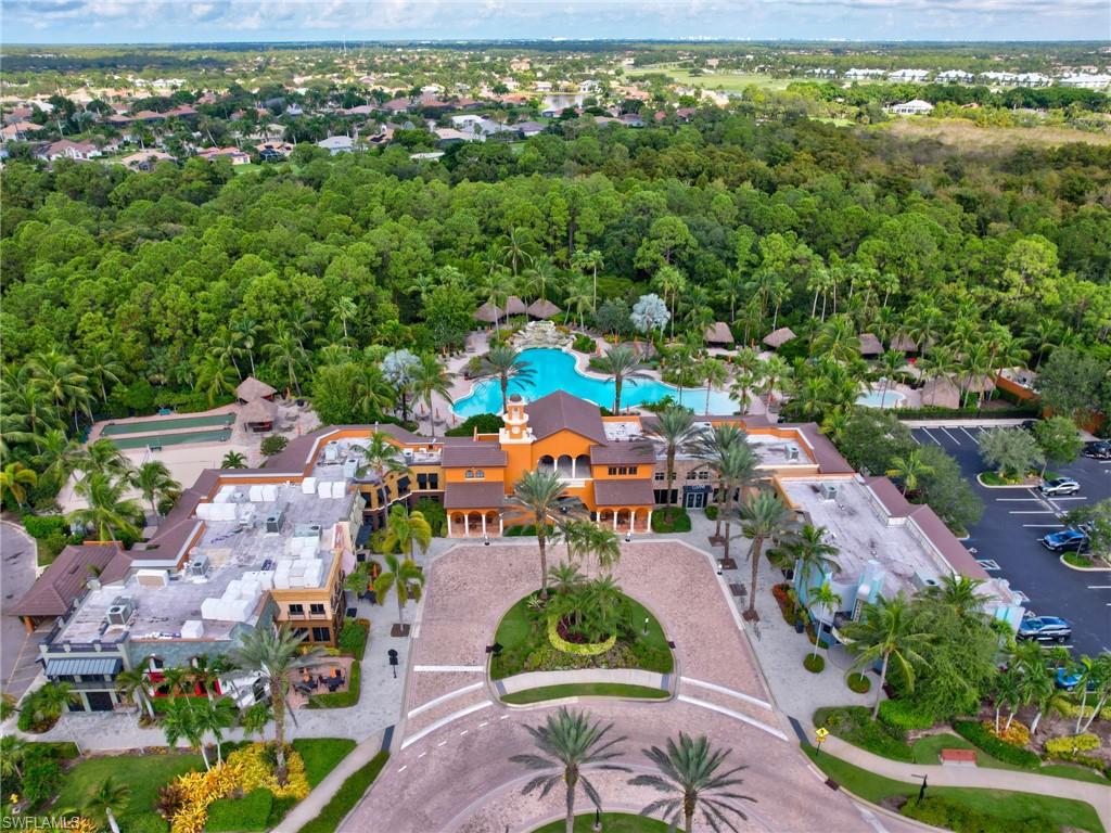 9066 Albion Lane North, Unit 5103 Naples, FL 34113 - Photo 36 of 40 an aerial view of residential houses with outdoor space and trees